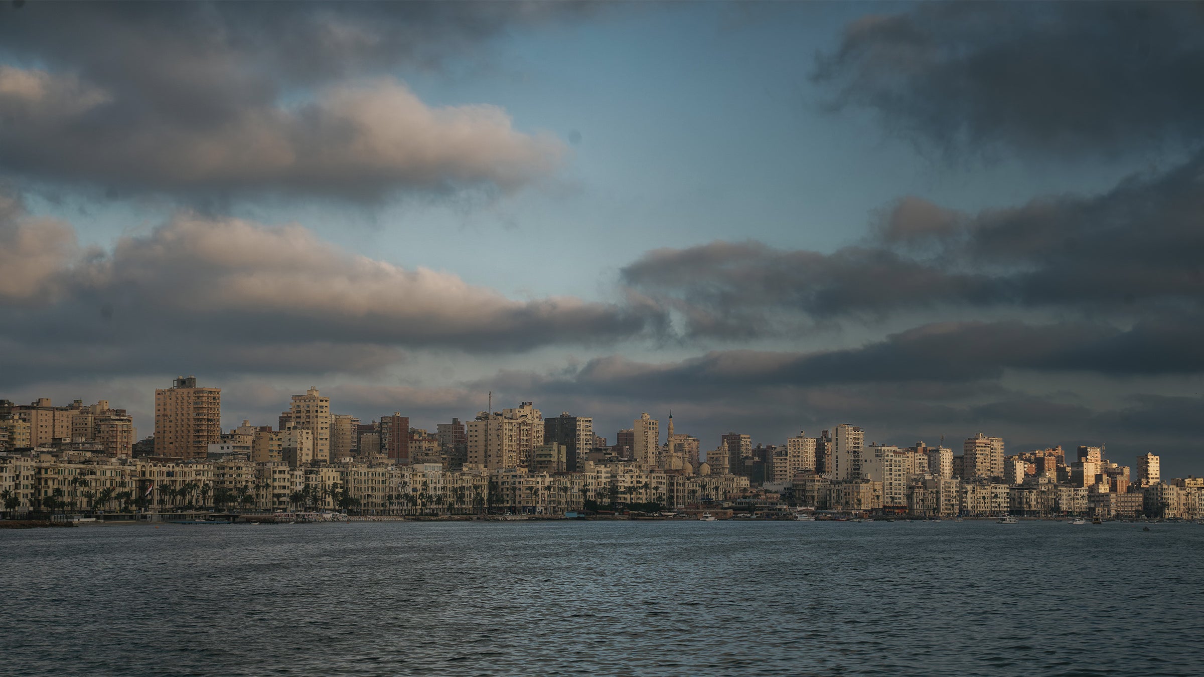 Alexandria coastline beneath a dramatic sky